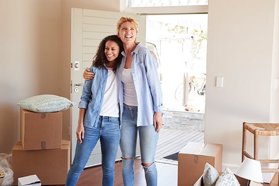 Couple standing in entryway of new home