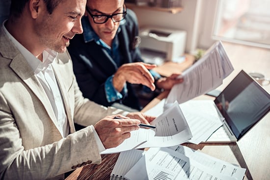 Reviewing paperwork with loan officer