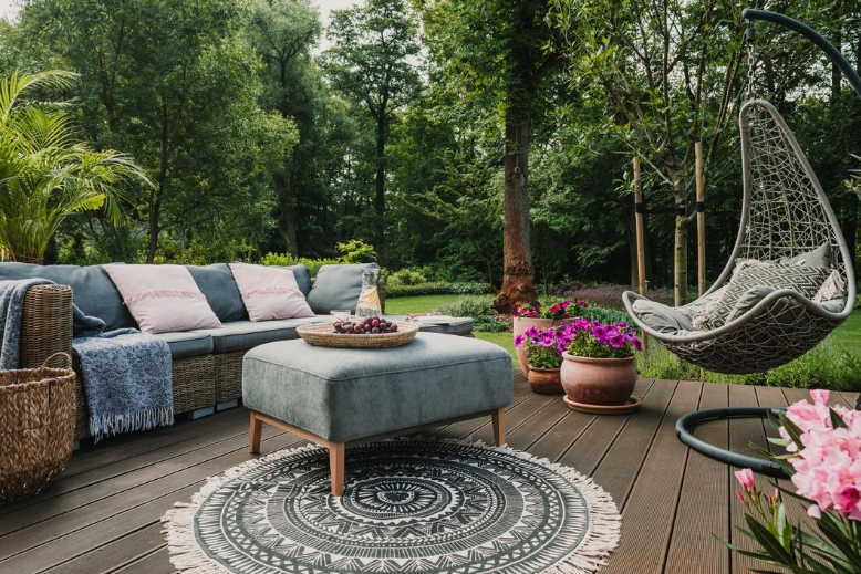 Backyard patio decorated with furniture